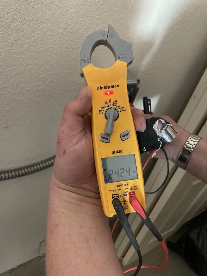 Voltage testing with clamp meter during Electrical Installation Services in Lake Los Angeles